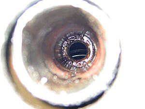 Pulled plug #2, soaked in oil and metal bits...-3usmu.jpg