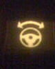 Yellow steering wheel, arrow left and right side of it??-image-1921202968.jpg
